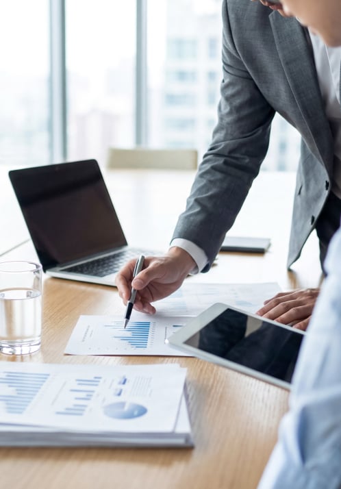 Investment professionals reviewing portfolio performance and fund growth initiatives.